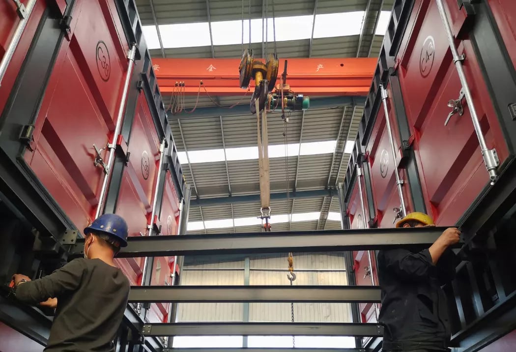 Workers at FOREMOST installing modular self-storage units, optimizing vertical space for efficient warehousing.