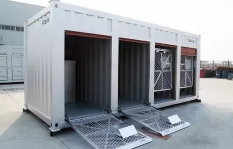 Customizable white modular storage container with dual swing-out doors and security grilles, equipped with foldable ramps for easy access.