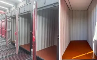 Empty interior of a shipping container with a measuring tape on the floor, ready for customization according to storage needs